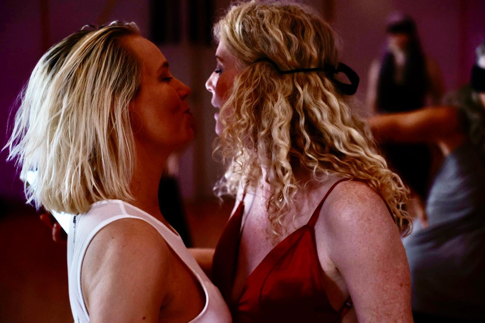 Two women in a quiet face-to-face moment of connection